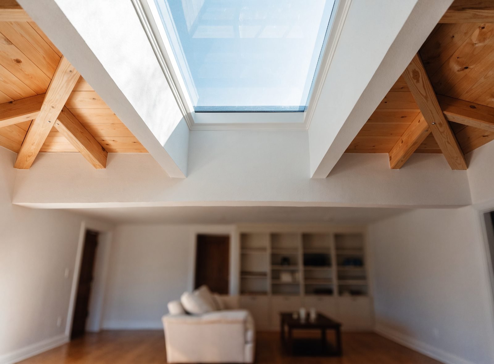 Dry skylight shaft in a vaulted ceiling with daylight coming through, no water staining